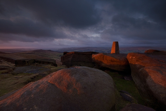 A winter sunrise at Stanage Edge southern trig point