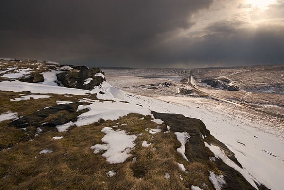 Snow clouds over Standedge from Pule Hill, overlooking the A62 Manchester Road. The route of the old turnpike road can also be seen crossing the moor from left to right, crossing the A62 and up Thieves Clough.