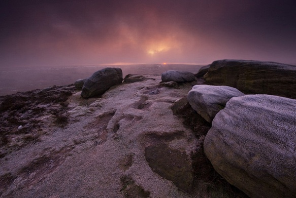 Low cloud almost obscures sunrise on Higger Tor.